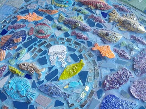 bricolage mural of fish and jellyfish in water